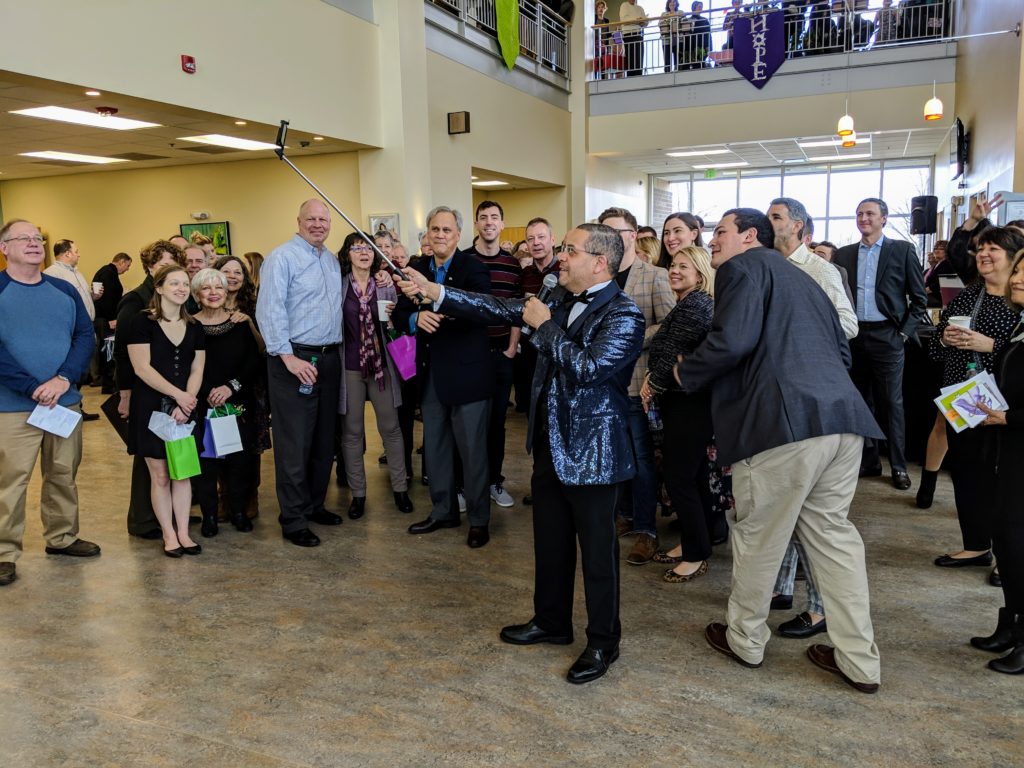 Rafael Sanchez takes a selfie with the Taste of Hope crowd.